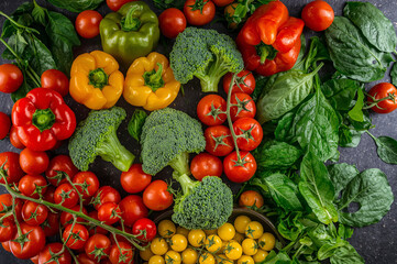 Fresh vegetables: broccoli, spinach, peppers, tomatoes, flat lay 
