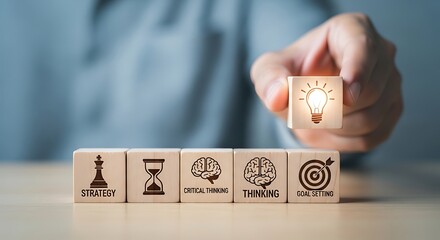 Hand placing a lightbulb block among strategy icons representing creativity innovation and problem solving for business success and future planning