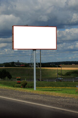Background for design, white billboards on city streets and along roads in the summer day