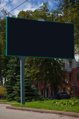 Road signs and information boards on the streets of the city on a summer day. Background for pointers, design and advertising.