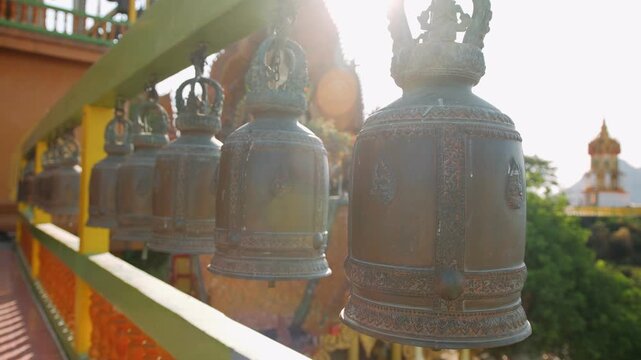 Traditional bronze bells in a Buddhist temple in Kanchanaburi, Thailand. Wat tham sua temple. 