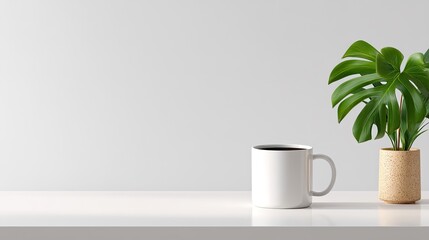 Minimalist workspace with white mug on a clean surface and a green plant beside it, suitable for modern and stylish interior concepts and lifestyle themes