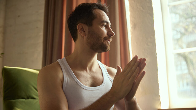 Man rubbing palms together before applying skincare. Concept of wellness platforms, lifestyle media, mindful routines, preparation steps, soft daily care atmosphere.