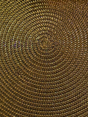 Woven gold colored table place mat
