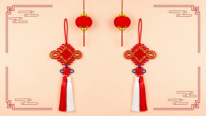 Two traditional chinese decorative knots and small lanterns hanging against a light beige background, symbolizing good fortune and celebration for the new year or festival