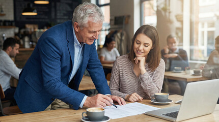 Business meeting in cafe: discussing documents and financial plans