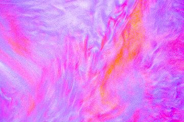 Shimmering multicolor abstract background. Liquid glitter paint texture waves and swirls. Beautiful shiny blue and pink glitter texture. Metallic paint close-up as a holiday background.