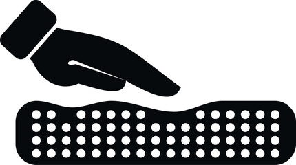 Hand pressing down on a mattress surface with pressure, creating an impression