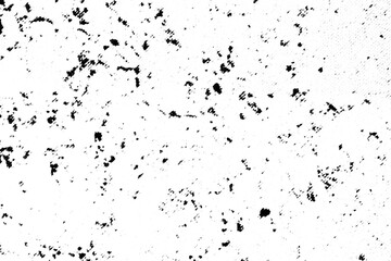Obraz premium Macro halftone print of irregular black ink speckles scattered across a transparent background. With softened focus, the pattern resembles worn paper, dust, or weathered grain.