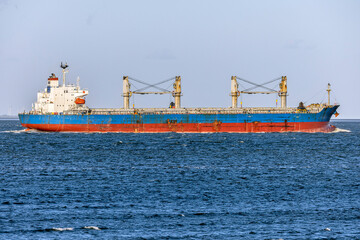 Germany, Elbe River Estuary. General Cargo ship entering the river Elbe mouth near Cuxhaven