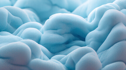A close-up view of fluffy, abstract shapes with soft blue hues, resembling clouds