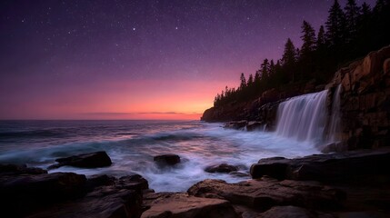 Obraz premium Majestic waterfall cascades into the ocean under a vibrant twilight sky with stars and sunset hues