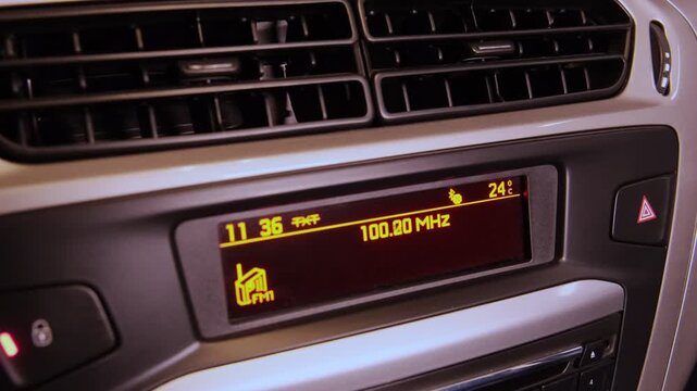 Digital car stereo display automatically searching and scanning for available fm radio stations