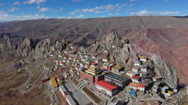 Aerial Drone View of Zizhu Monastery (Tsudrug temple) Nestled in Rocky Tibetan Mountains