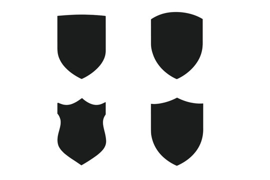 Four unique black shield shapes designed for various uses in graphics and branding without intricate details or patterns