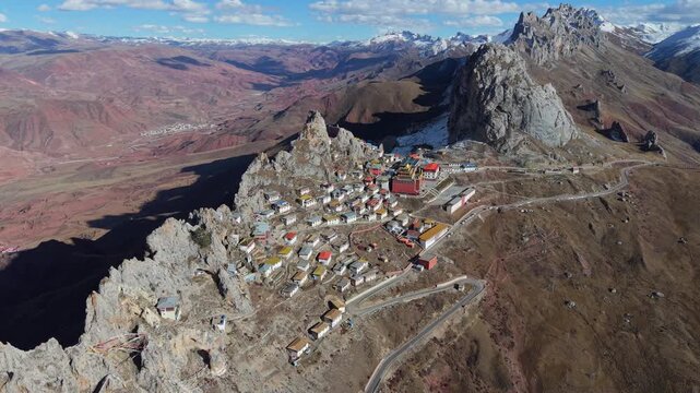 Aerial Drone View of Zizhu Monastery (Tsudrug temple) Nestled in Rocky Tibetan Mountains