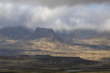 low clouds partly cover the coastal mountain range, Snaefellsnes Peninsula, West Iceland