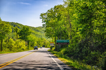 Wintergreen resort ski village mountain town sign in Nelson county, Virginia and Blue Ridge Parkway road directions in summer