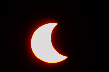 Partial solar eclipse at sunset