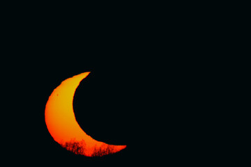 Partial solar eclipse at sunset