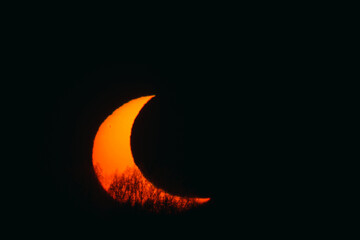 Partial solar eclipse at sunset