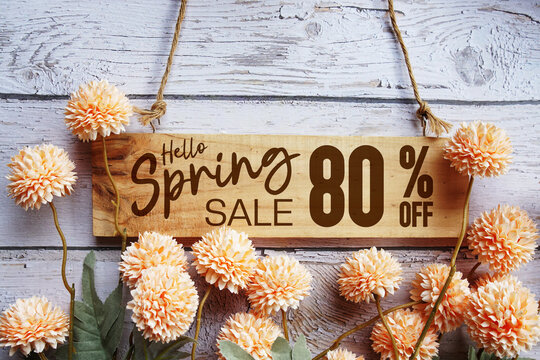 Spring Sale 80% off with flower bouquet decoration on wooden background - Powered by Adobe
