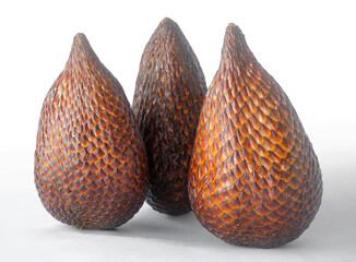 Group of Three Intact Indonesian Snake Fruits, Buah Salak, Clustered on Bright White Surface