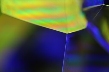 Purple and yellow liquid glowing flat film, colourful macro abstraction, interference pattern, glowing elements