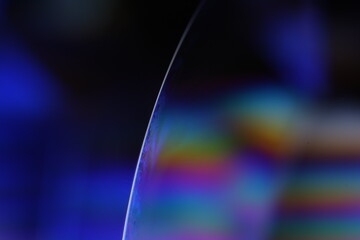 Blue minimalistic abstraction. Bright rainbow reflection of liquid in macro, surrealistic background, water surface, interference pattern, one line