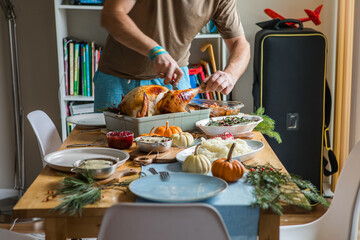 Thanksgiving dinner table with roasted turkey and festive dishes