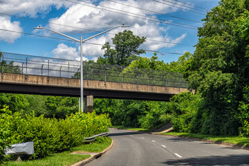 Herndon, USA - May 24, 2025: Virginia empty road in town of Fairfax County with nobody and overpass...