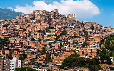 Typical red brick houses on a hill in Medellin city, Colombia