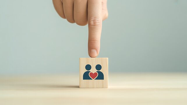 Hand pointing at couple block