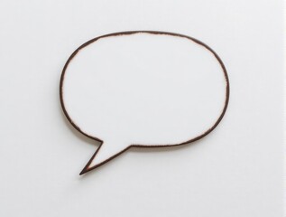 Empty worn speech bubble graphic on light wall