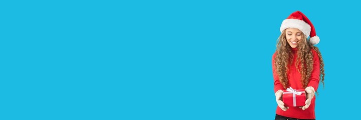 Young woman holds Christmas gift boxes