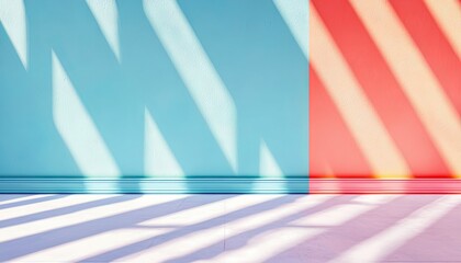 A colorful wall and floor are illuminated by bright sunlight, casting shadows across the surfaces. The image features a vibrant blue and red wall with a white f