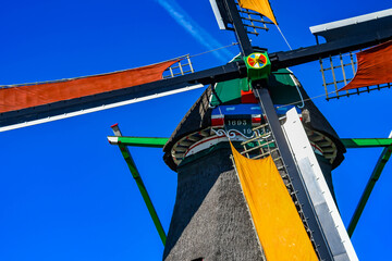 Detailed view of the mechanism and thatched roof of a 17th-century Dutch windmill.