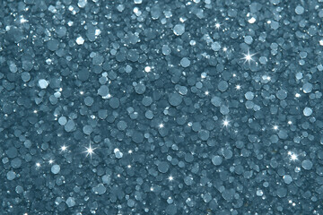 Close up of dark blue sequin glitter texture background with bright star lens flares