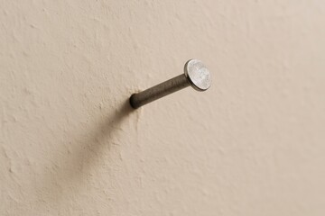 Nail in Plaster Wall