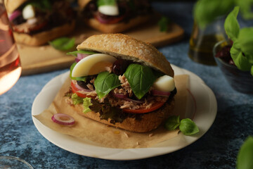 Traditional French sandwiches Pan Bagnat with tuna and salad niсoise