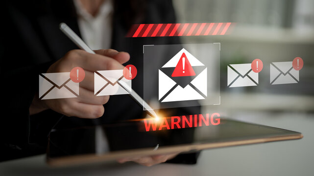 A digital device displays a warning alert for potential email threats, emphasizing the need for cybersecurity awareness and effective communication strategies. Gantry