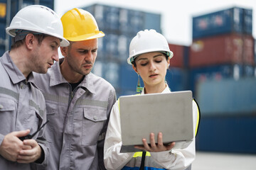 Caucasian woman logistics workers working with man worker at container site	