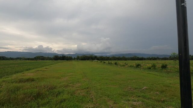 Motorbike Ride Through Wide Fields &ndash; POV Scooter Riding - Java, Indonesia, South East Asia - November 16th 2025 - countryside shot from running motorbike with action cam