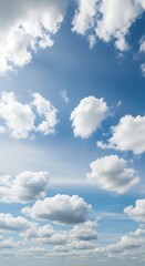 Fototapeta premium A serene photograph showcasing a vivid blue sky, dotted with fluffy, white cumulus clouds. The sunlight filters creating gentle shadows