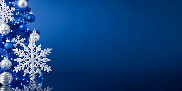 Blue christmas tree with snowflakes and ornaments on a dark blue background