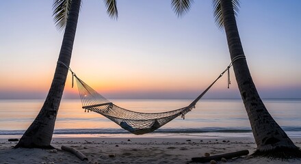 A serene scene of a hammock strung between two palm trees on a sandy beach at sunset, with a tranquil ocean backdrop