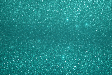 Fototapeta premium Turquoise glitter sparkle texture background with bright shimmering light for luxury festive decorative abstract design use