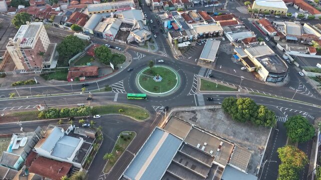 Lins, Sao Paulo, Brazil. 12.01.2025. Aerial view of urban center at sunset, showing streets, buildings, and houses.