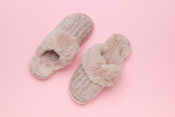 Cozy Fluffy Slippers on Pink Background: Furry Comfort and Style for Relaxing at Home