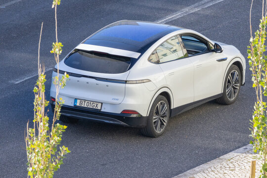 White xpeng g6 electric car parked on street